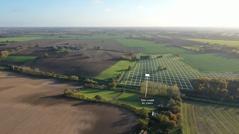 Aerial view of Suffolk farmland with a grid of squares marked over one field and an arrow to a single square: “This could be yours”